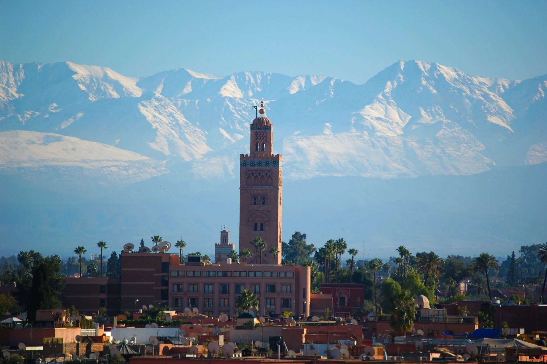 10 day morocco tour Koutoubia Mosque in Marrakech, Morocco, with its iconic minaret standing tall against a clear blue sky.